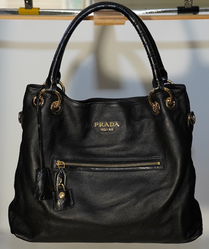 A black leather Prada handbag